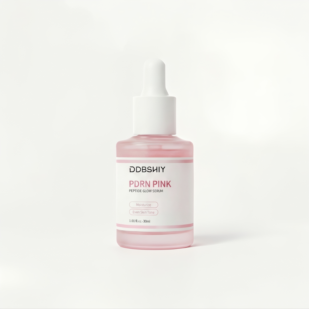 Pink serum bottle with white cap on a light gray background